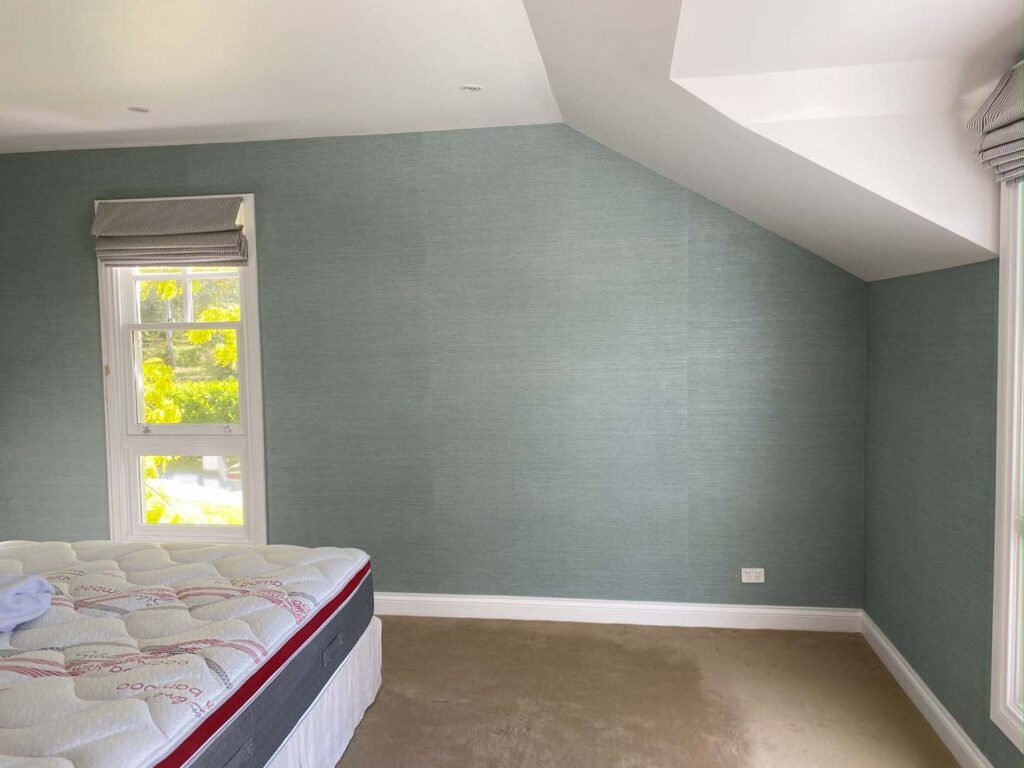 Two accent colours contrasting with white and a light blue in bedroom painted by Southern Highlands Painting and Wallpapering