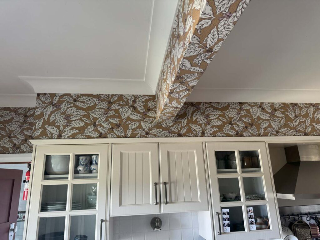 Wallpaper covering entire living room installed by SHPW