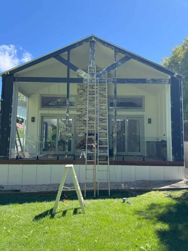 Southern Highlands Painting and Wallpapering crew prepping to paint the exterior of home in Bowral